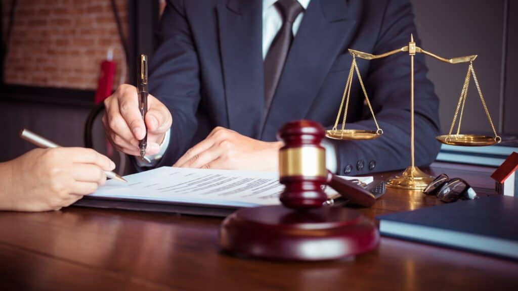 Closing Attorney vs Title Company FAQ attorney lawyer writing desk gavel judge