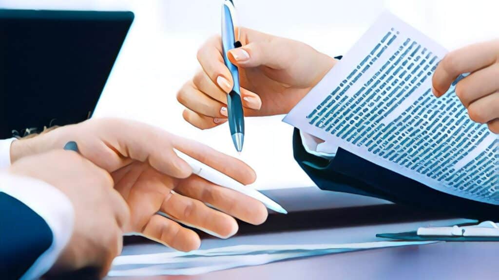 Closing Attorney vs Title Company title company contracts documents ink pen hands suits business office desk writing