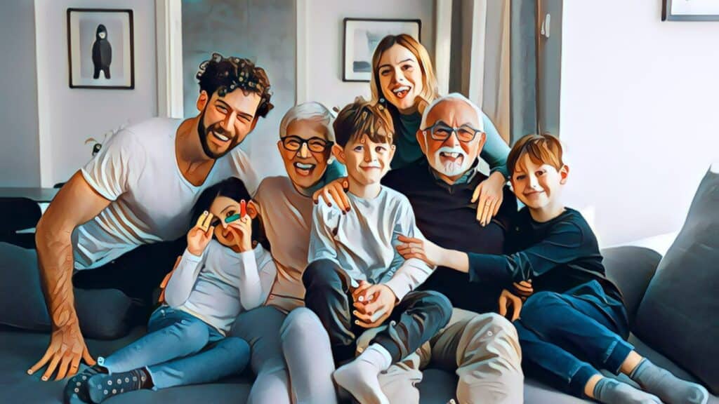 The Importance Of Financial Freedom - family smiling sitting on sofa couch grandparents
