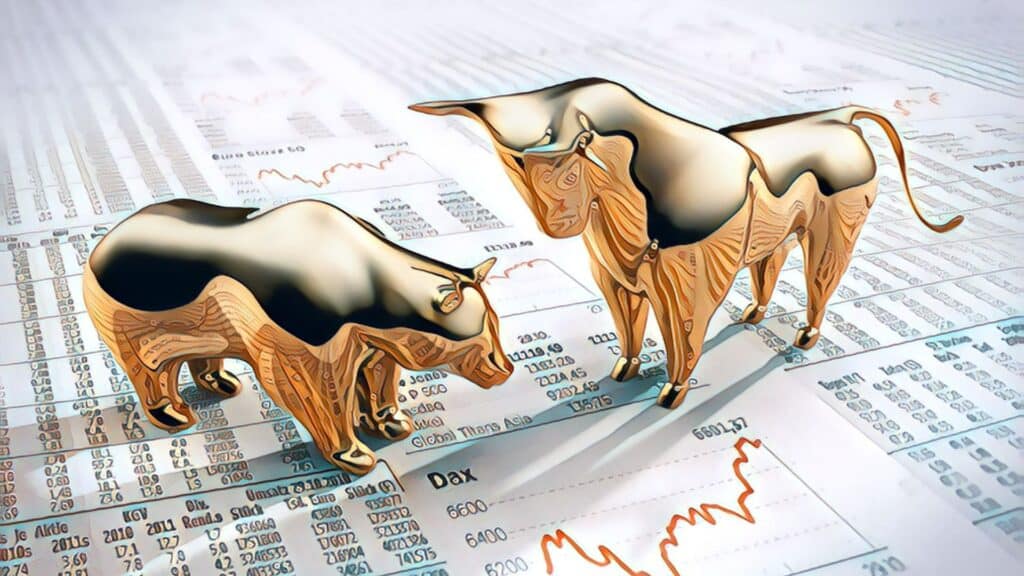 The Importance Of Financial Freedom - stock market charts bear bull gold statues