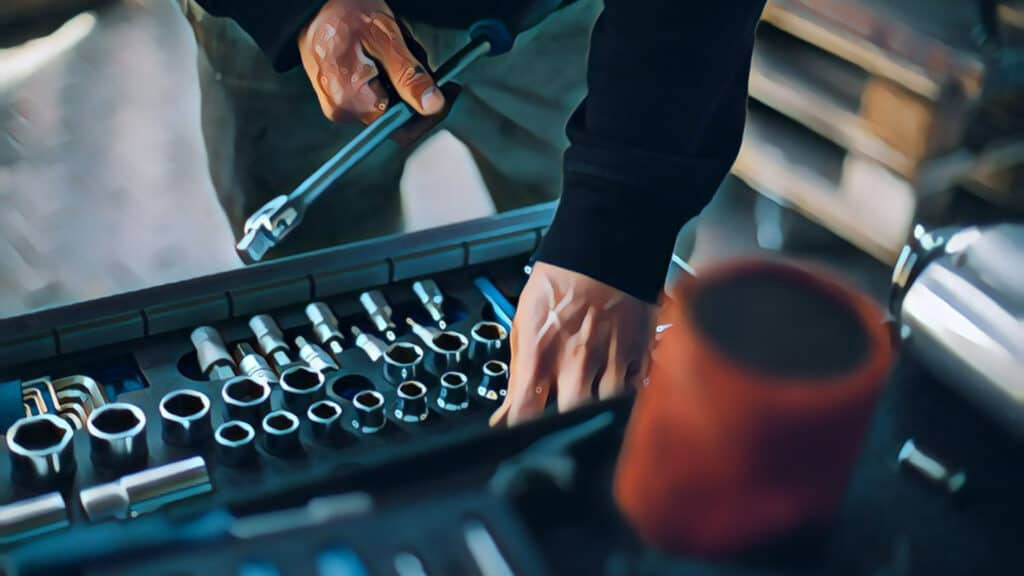 man looking into ratchet toolbox