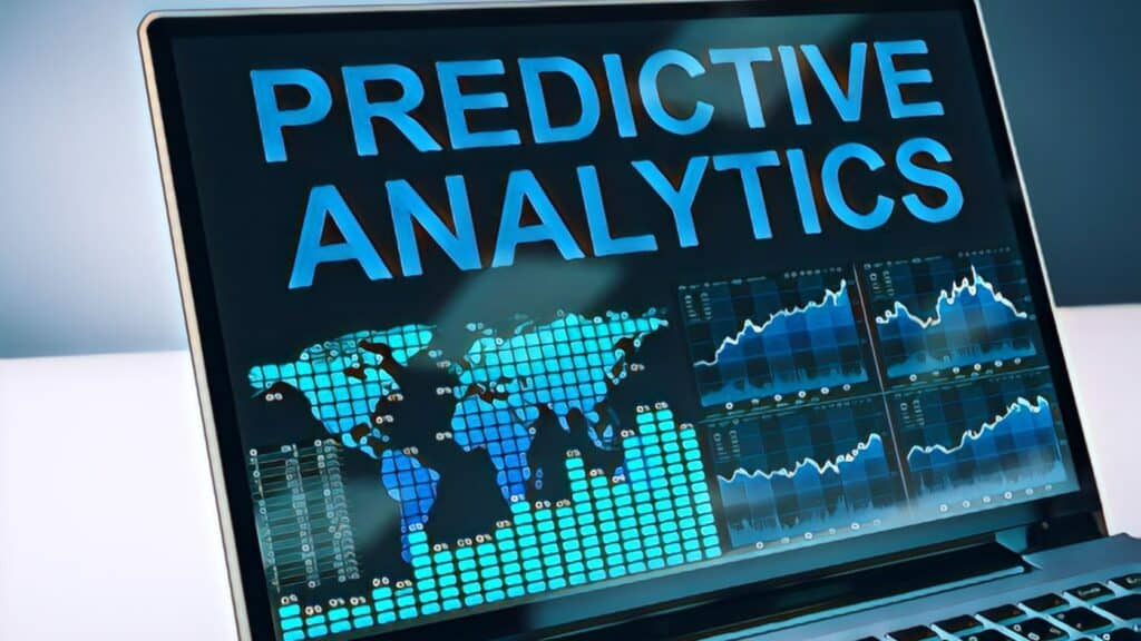 2023 Housing Market Projections: Is Home Affordability on the Horizon? Open laptop computer predictive analytics and bar charts on screen.