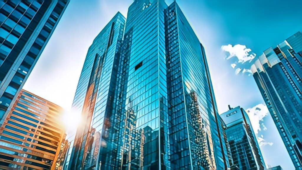 Commercial Real Estate Investing Opportunity Zones (How To Utilize Special Tax Benefit Funding) - tall skyscraper glass commercial building real estate major city shot from worms eye view