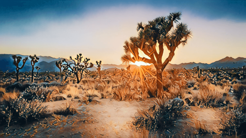 Ultimate Guide to California Real Estate Investing - Mohave desert, cactus, sand, deserted, desert plants everywhere, beginning of dusk, mountains in background, talk desert tree with greenery at top