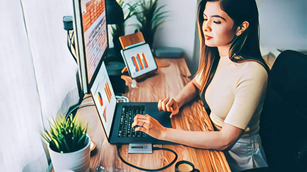 Top 10 Best Ways Virtual Assistants Help Real Estate Investors Increase Cash Flow, Asian woman sitting at home office desk in front of window, working on laptop computer, wood grain desktop table, multiple computer monitors on desktop table, small desktop plants, desk lamp, woman has long black hair, wearing egg shell colored short sleeve top, seated at desk