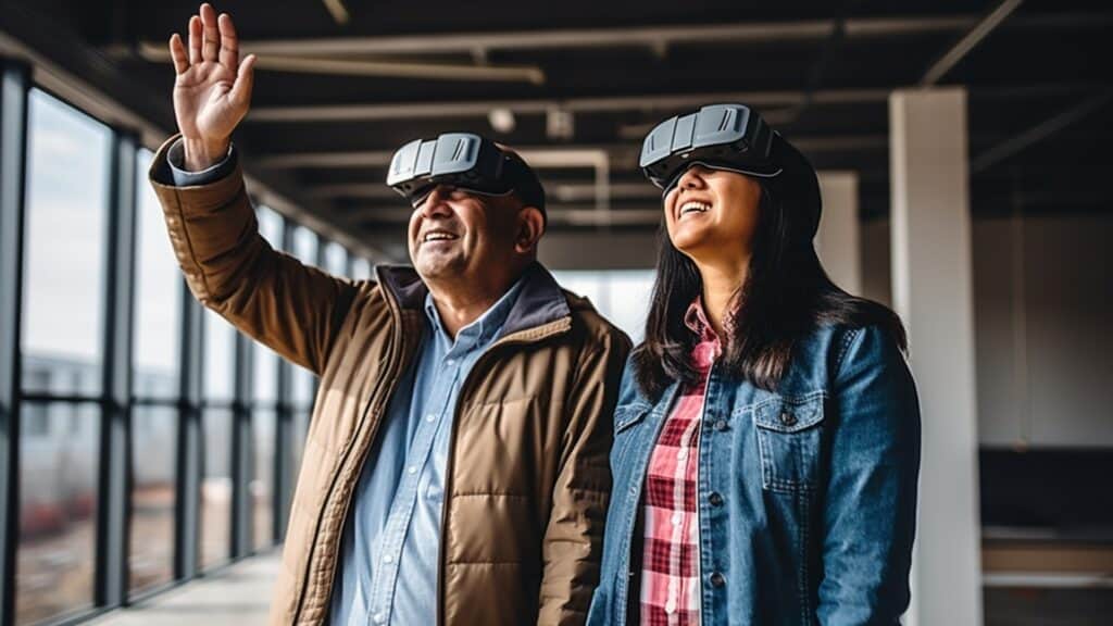 How Apple Vision Pro Could Revolutionize the Real Estate Industry - couple inside of vacant building looking up smiling wearing AR VR headset